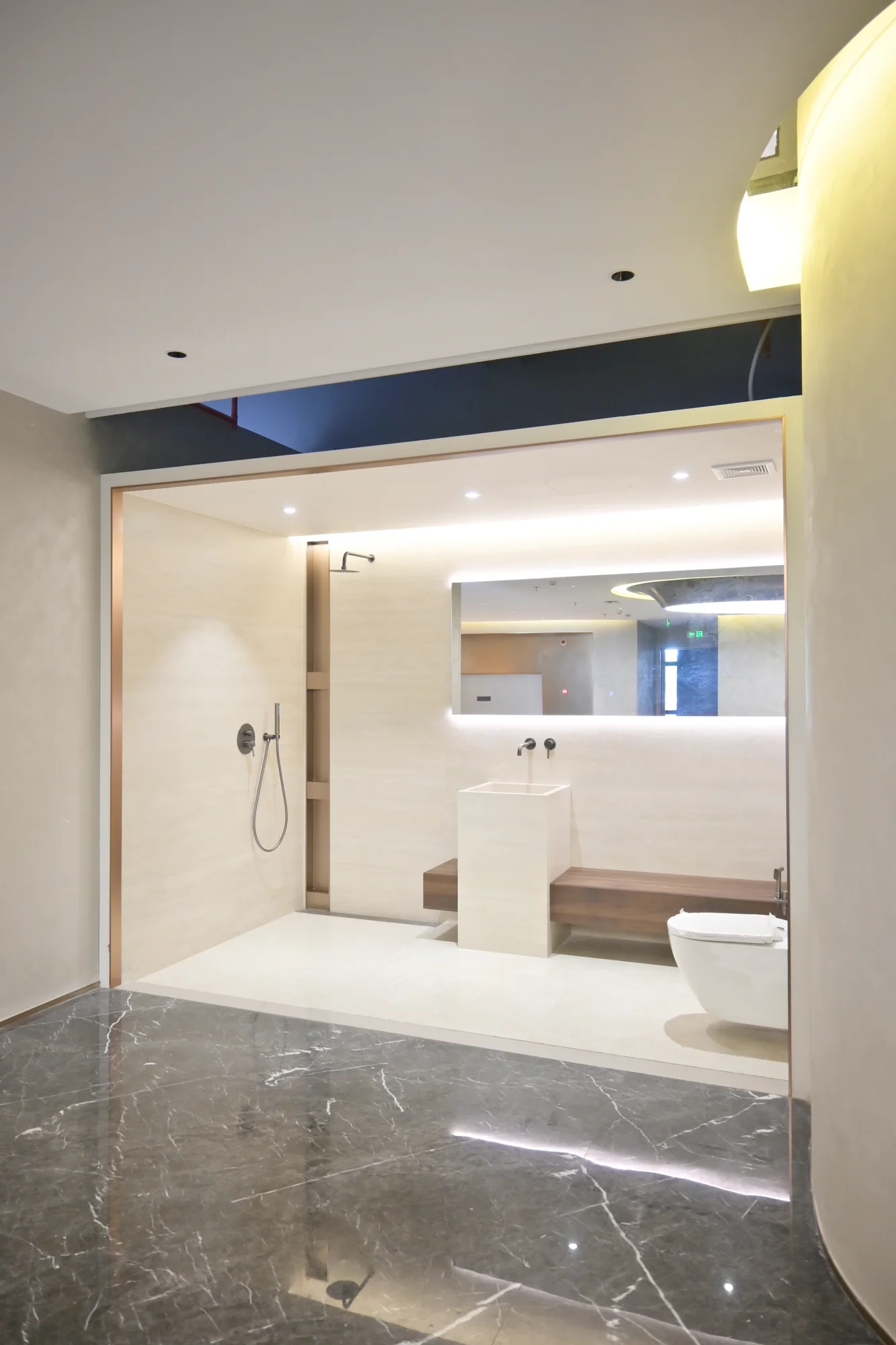 Hotel bathroom sample viewed through a wide room opening